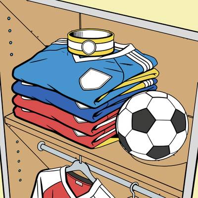 Färglagd version: Vikta fotbollströjor med fotboll
